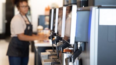 Beans & Brews employee preparing drink